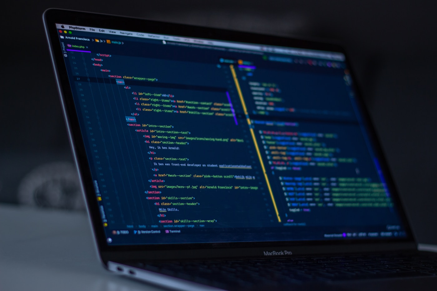 Developer workspace with custom software development on multiple monitors